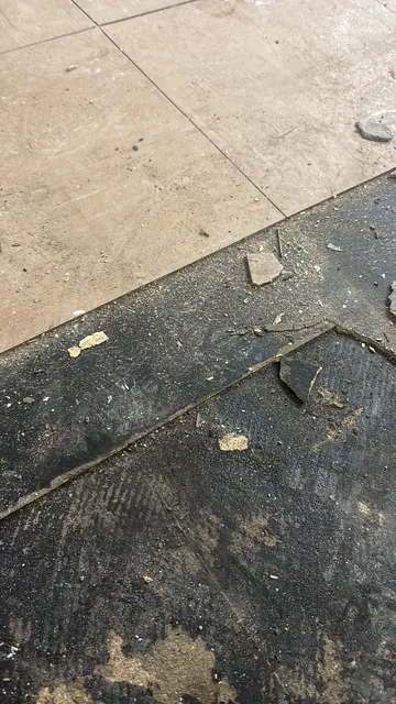 Black bitumen mastic floor removal in a SE22 flat